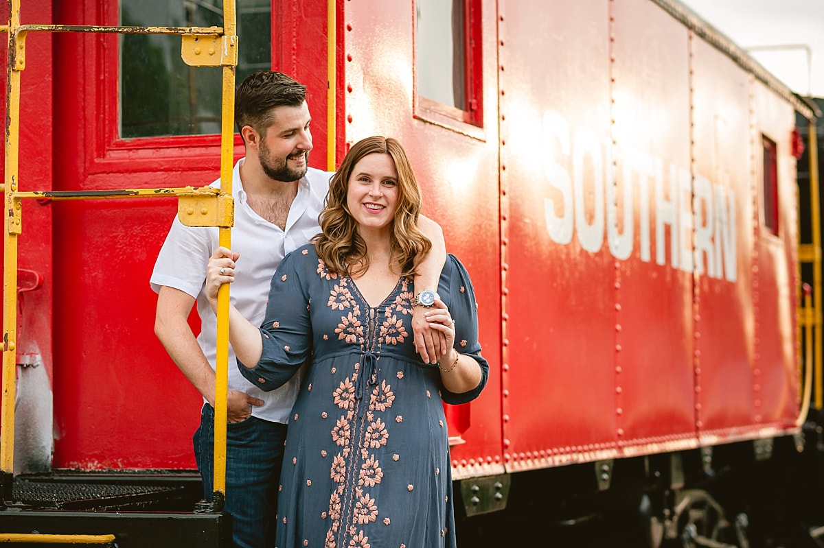 engagement photos by the trains at collierville town square