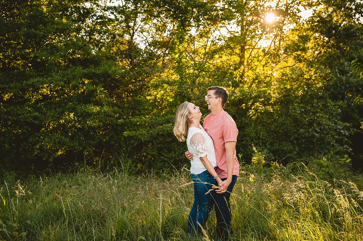 couple posing for engagement photos at shelby farms park in memphis, tn