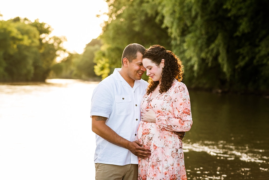 Portrait of father with pregnant mother at the creek in Memphis, TN