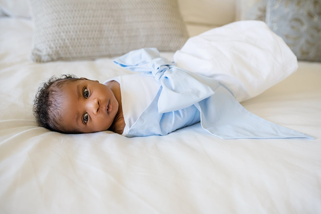 Baby boy wrapped in a Bow Swaddle by The Beaufort Bonnet Company for newborn photos in Collierville, TN