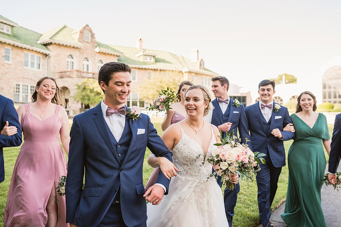 candid of bride and groom with their wedding party + Pink Palace Wedding + Memphis, TN