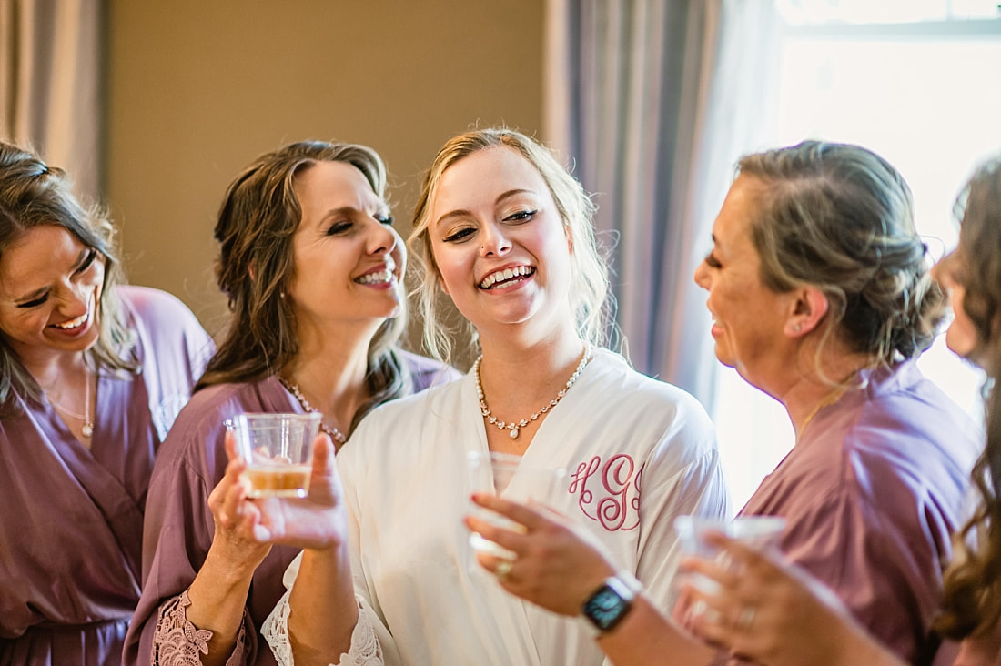 bridesmaids toasting to the bride + Pink Palace Wedding + Memphis, TN